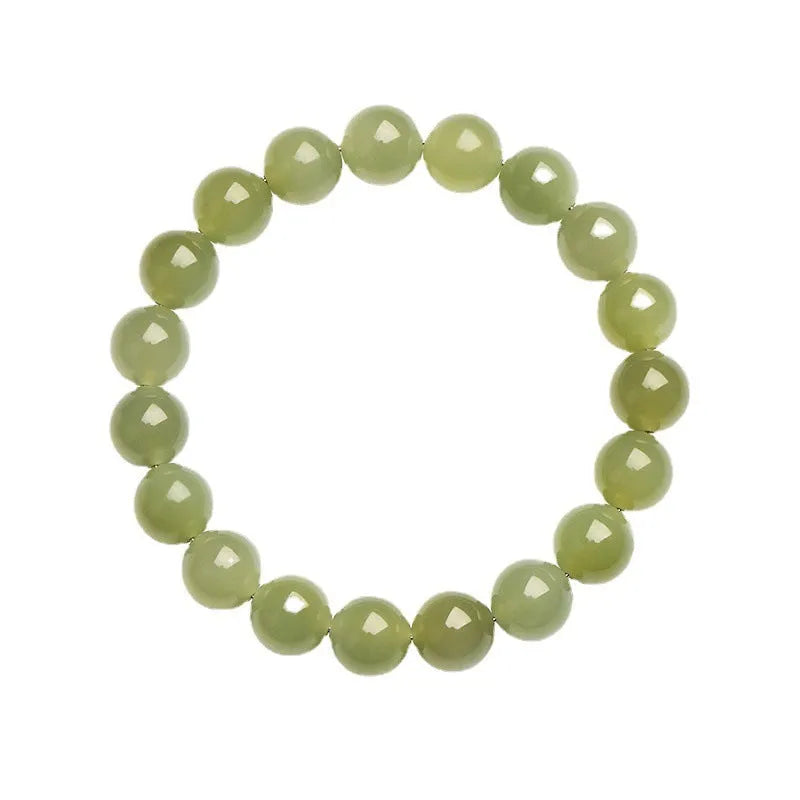 Polished Hetian jade beaded bracelet in ice-like clear water colour on a wrist.