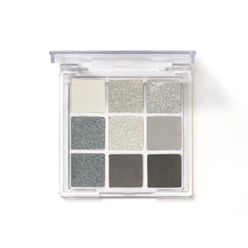 Smoked nine-colour eye shadow compact showing white silver black iron grey cosmetic shades
