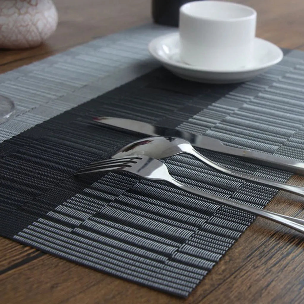 PVC non-slip dish mat in modern simplicity style protecting a wooden dining table