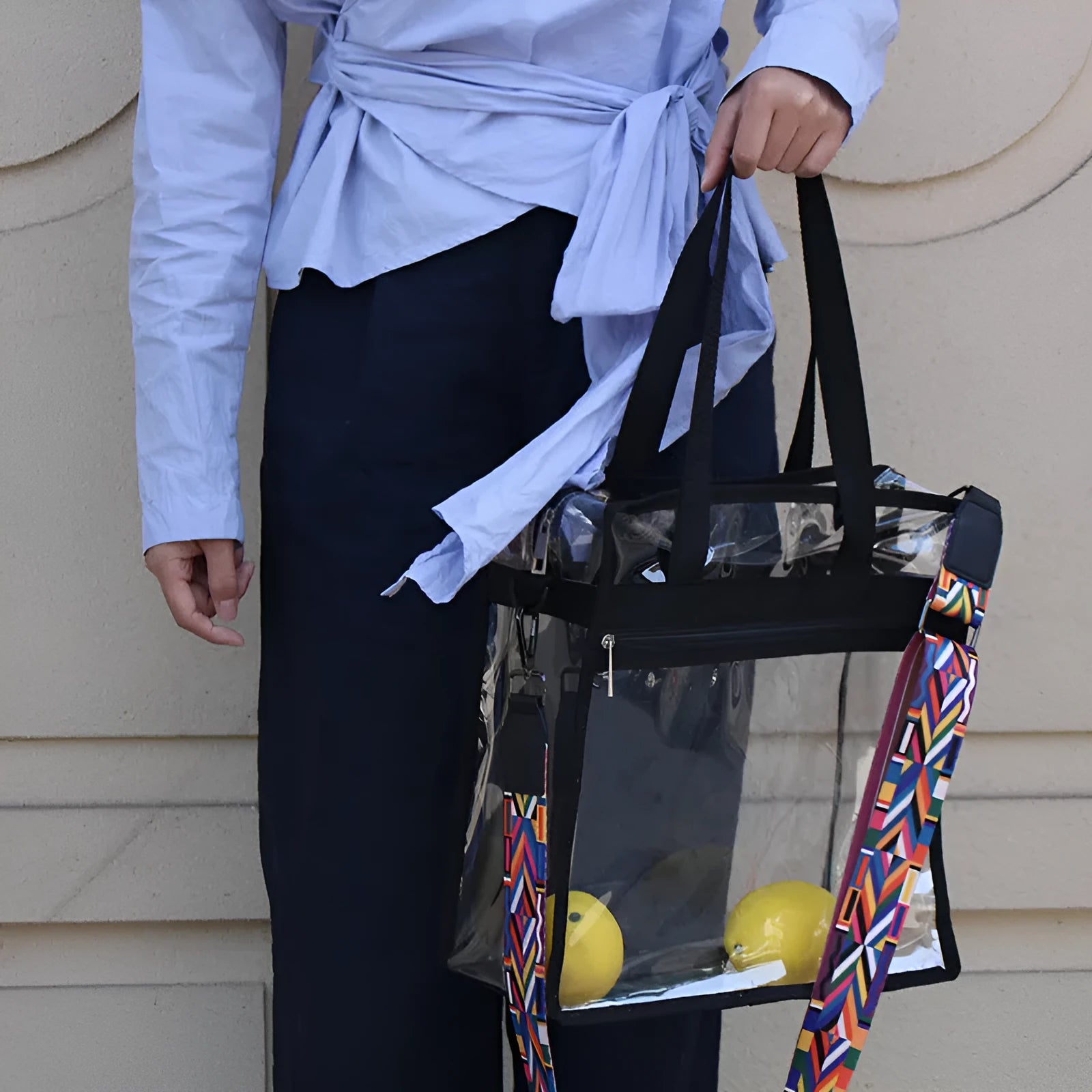 Women's PVC messenger bag with transparent front compartment and crossbody strap in a selection of colours.
