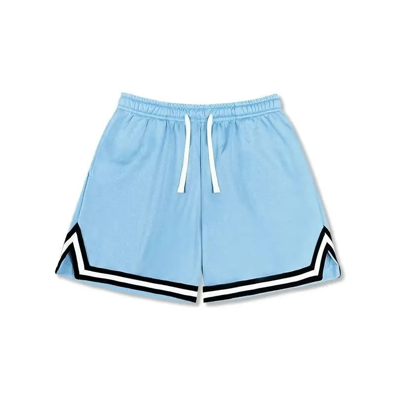 Man wearing loose grey sports shorts made from elastic polyester fabric.