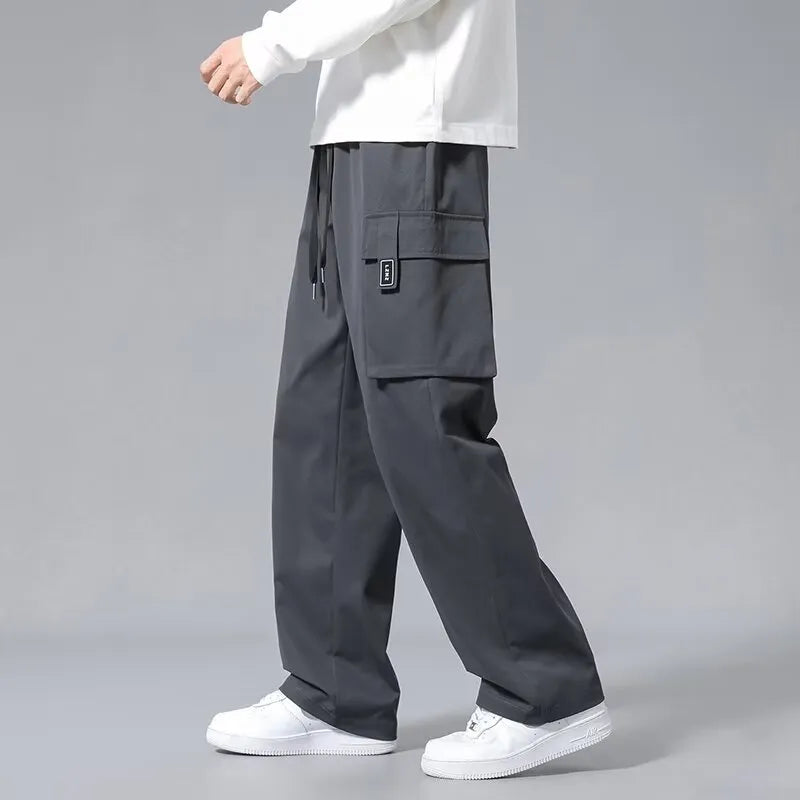 Boys straight leg cargo pants in Army Green with large pockets and a drawstring waist