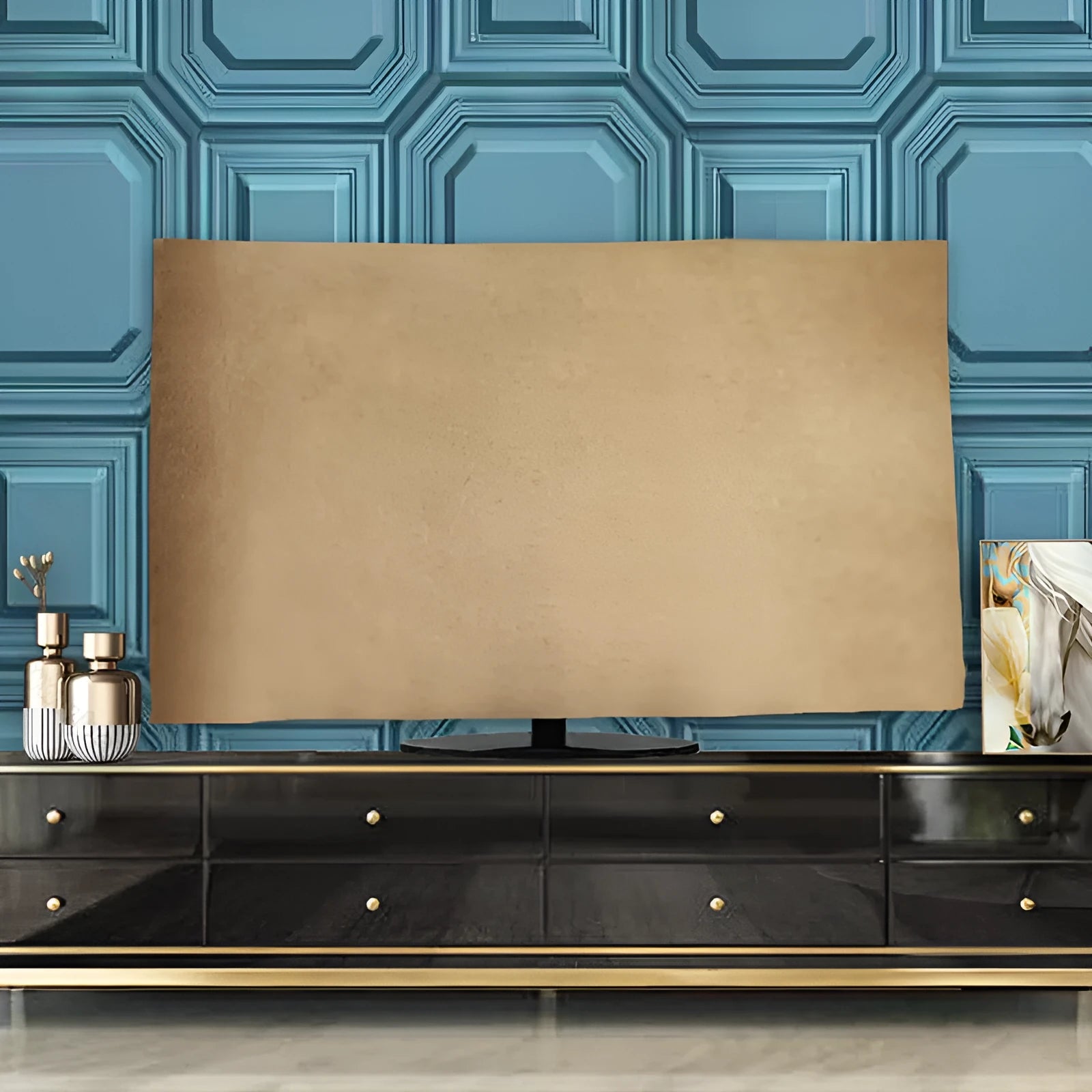 A pink velvet television cover draped over a flat-screen TV, showing its elasticated hem and soft fabric texture.