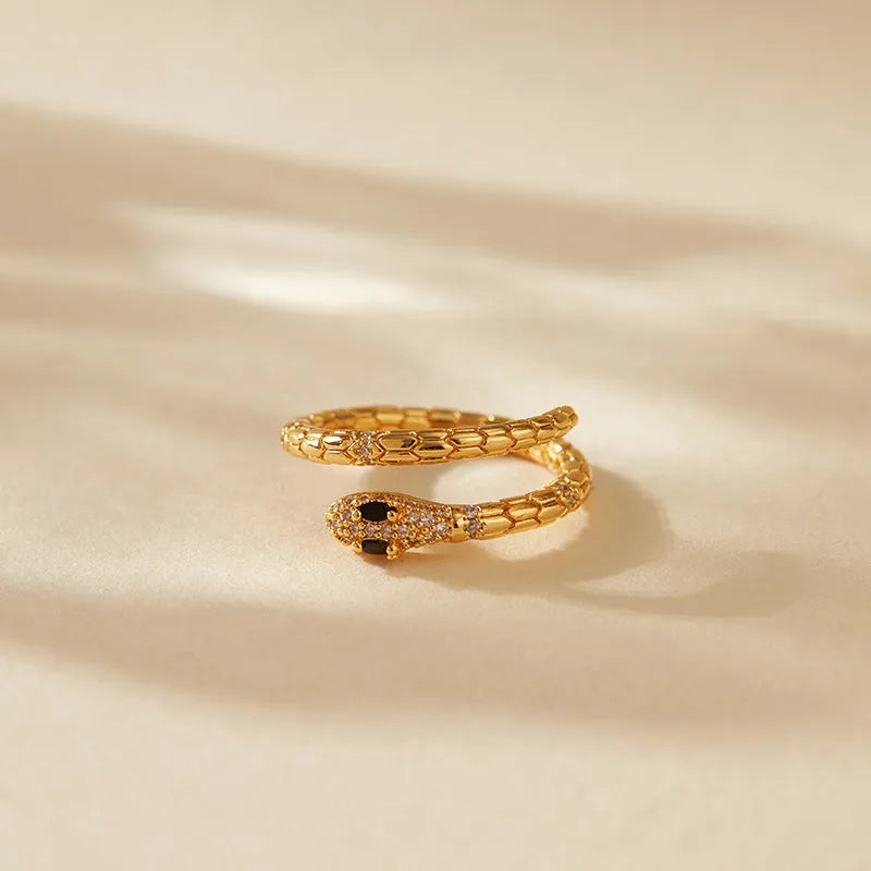 Adjustable copper snake ring with 18K gold plating on index finger