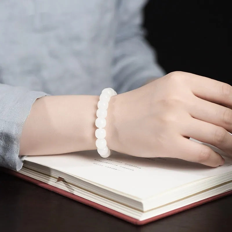 White Hetian jade barrel bead bracelet showing three size options: 5x6mm, 7x8mm, and 8x10mm beads.