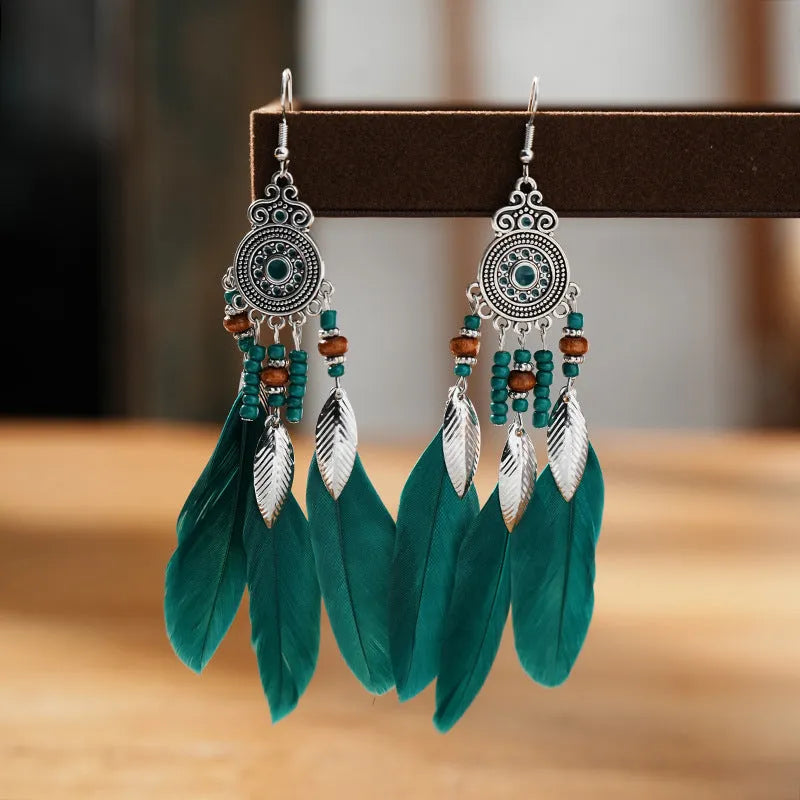 Round drop feather earrings with leaf detailing in various bohemian colours