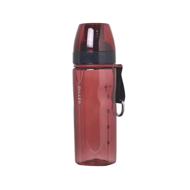 Blue portable sports water cup with a separate compartment for tea leaves on a wooden table.