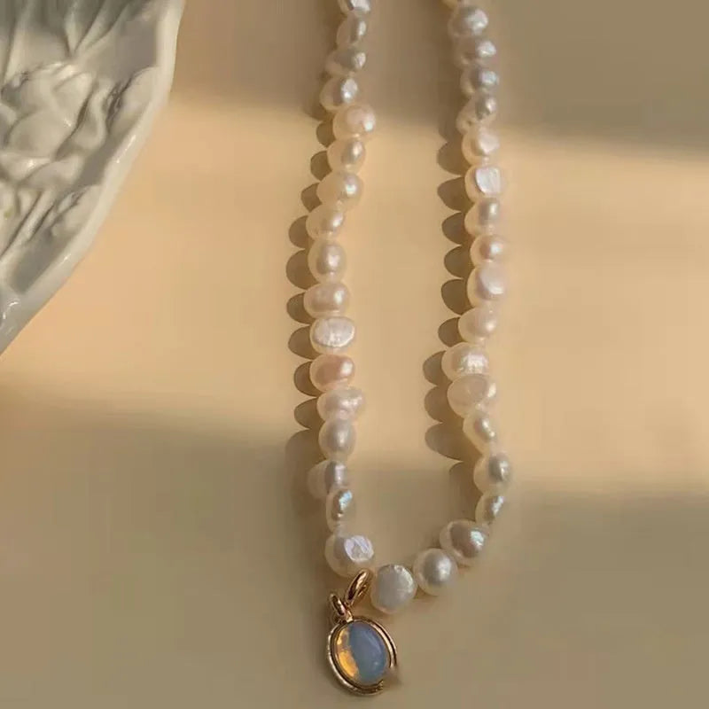 French Court vintage style alloy necklace with geometric pearl pendant on an adjustable chain.