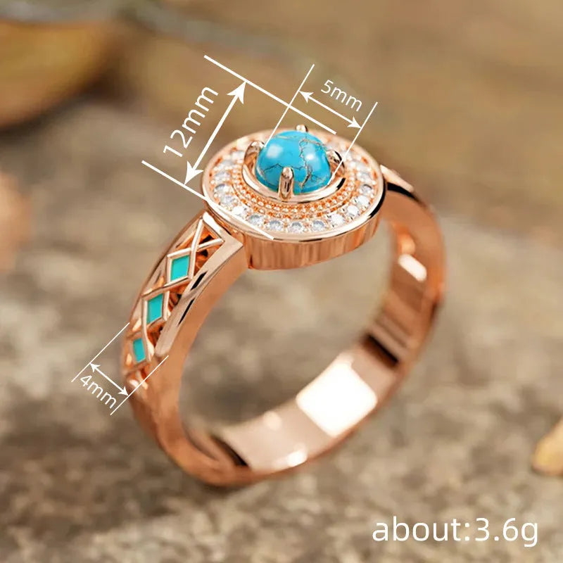 Close-up of a women's rose gold turquoise ring with geometric inlaid zircon stones on a copper band.