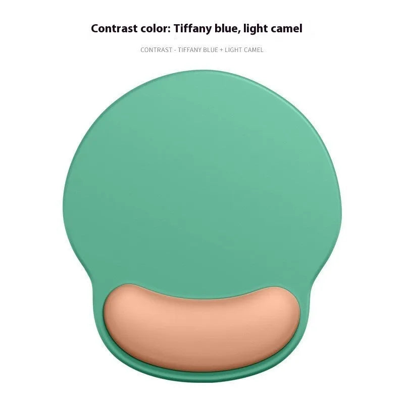 Silicone mouse mat with wrist rest in gradient colour pattern on desk