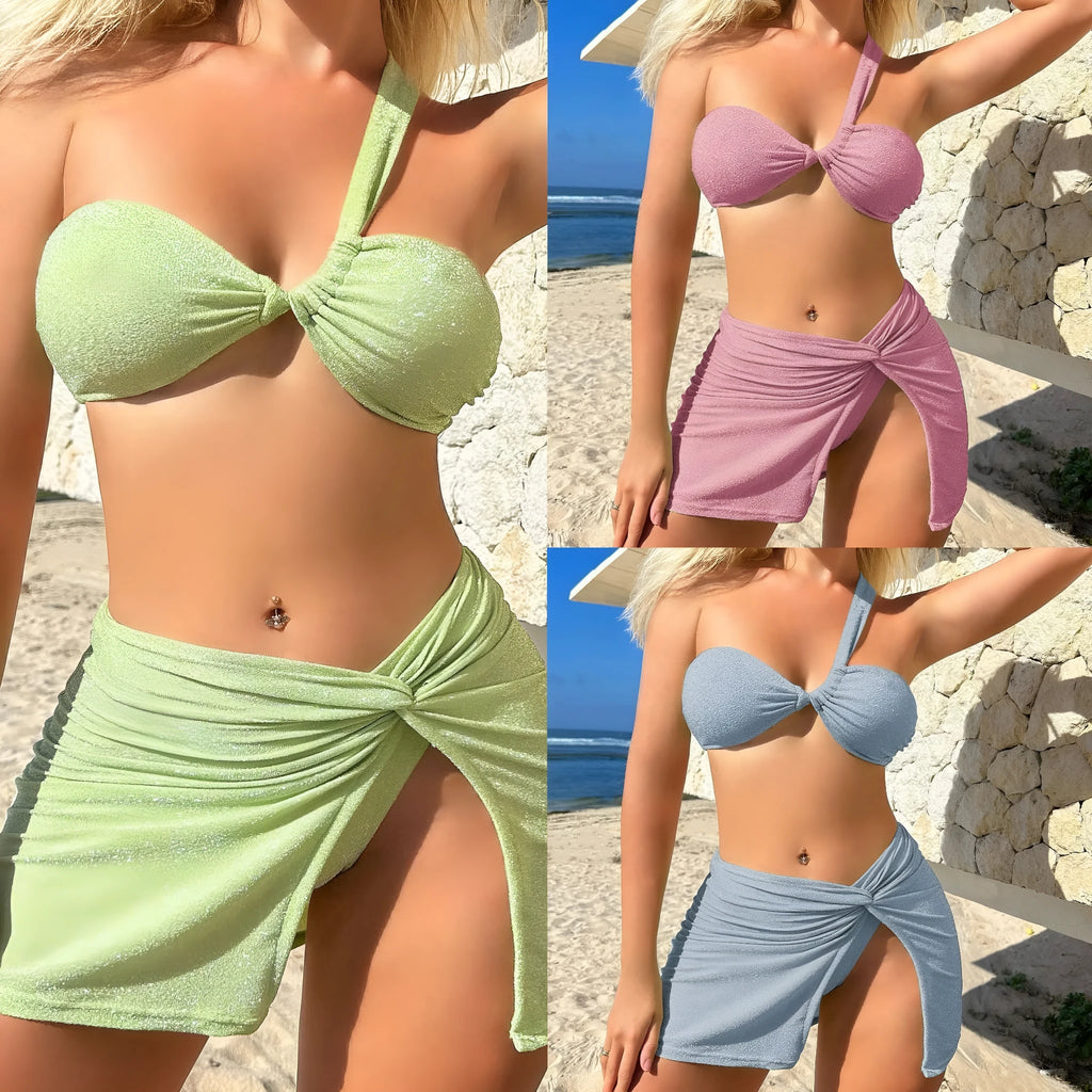 Light green one-shoulder tube top swimsuit three-piece set with matching skirt on a mannequin.