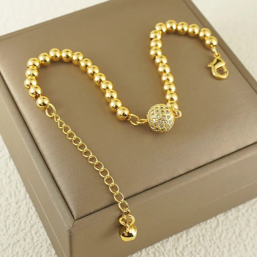 Copper bracelet with zircon beads and heart clasp in Arabic style design