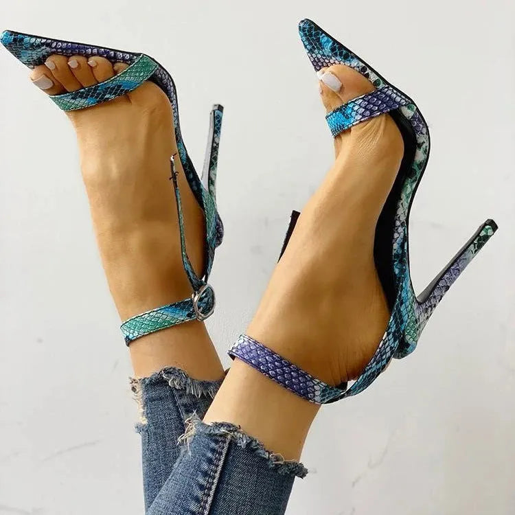 Blue women's high heel shoes with a buckle fastening and glossy patent leather finish.