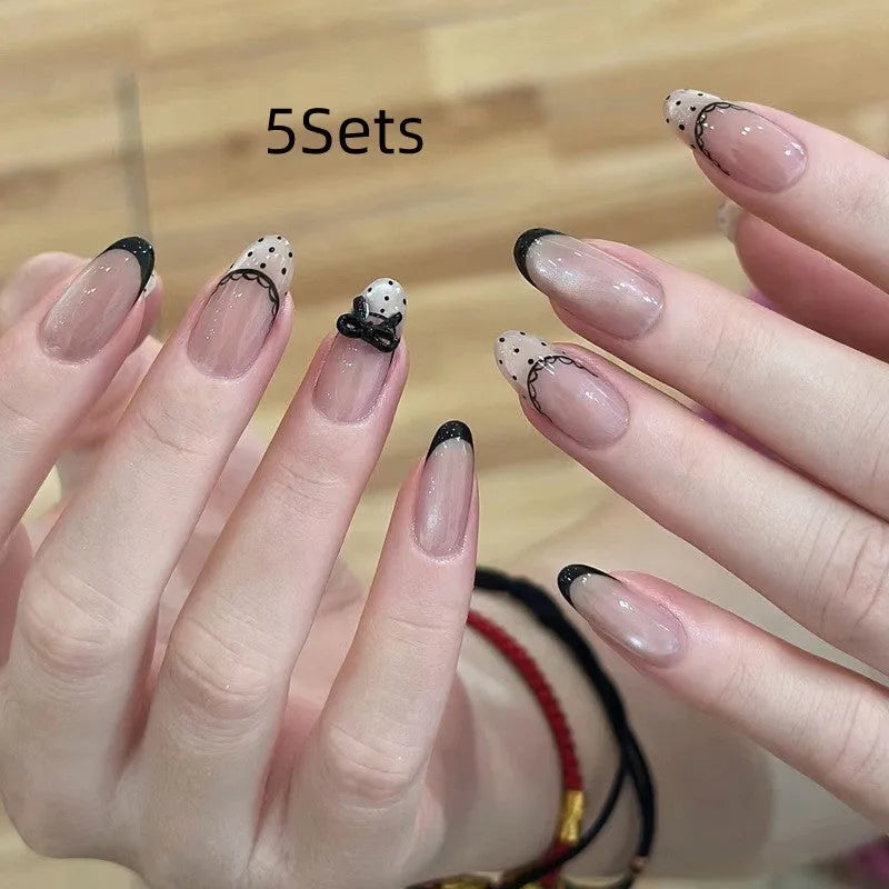 A set of artificial press-on false nails for women in assorted random colours and patterns.