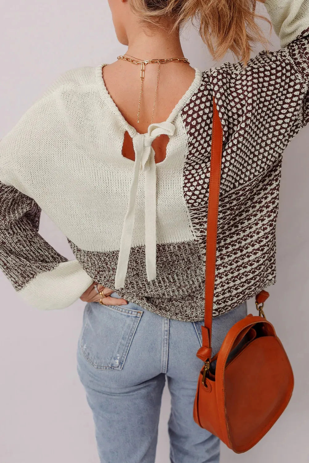 Dark khaki women's sweater with colour block design, back tie detail, and drop shoulder loose fit