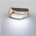 Solar-powered smiling face garden wall light with IP65 weather protection for outdoor courtyard and villa lighting