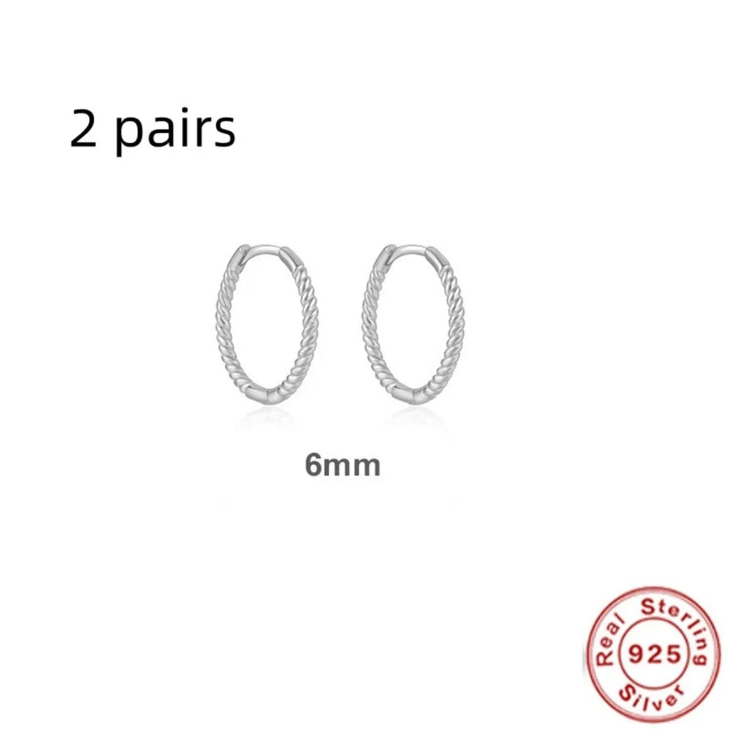 Sterling silver twisted ring earrings in geometric round design with gold or platinum finish