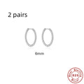 Sterling silver twisted ring earrings in geometric round design with gold or platinum finish
