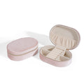 Oval velvet jewellery storage box in lake blue colour, showing flannel-lined interior and compact size.