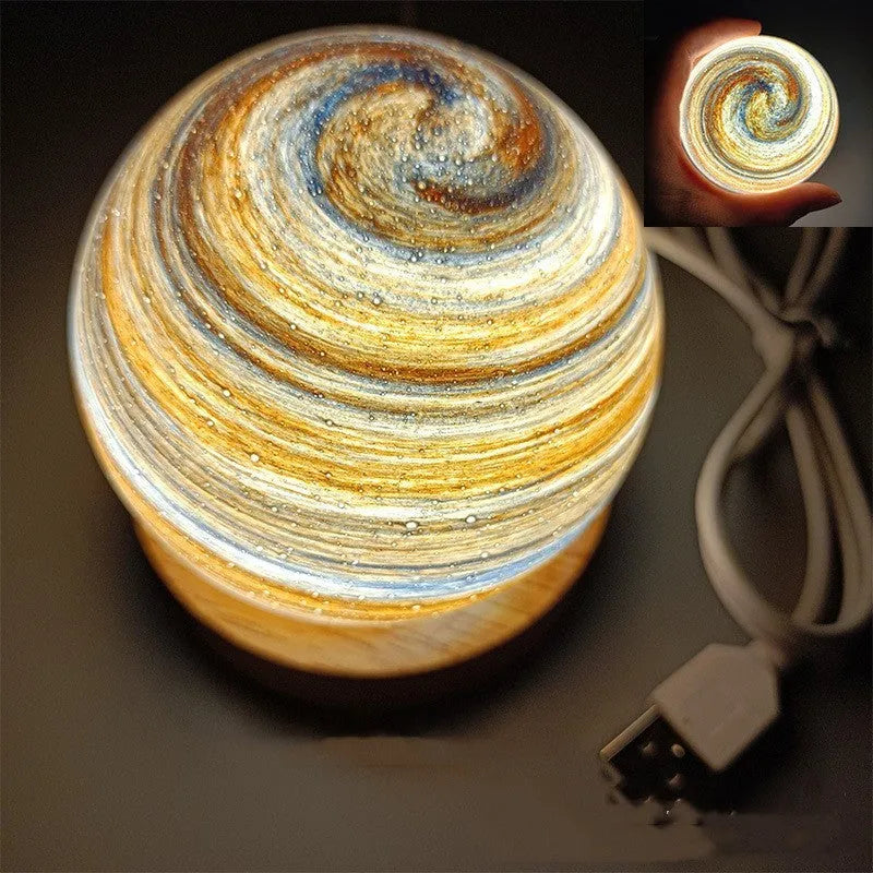Planets themed USB night light with modern design and three-colour dimming on bedside table.
