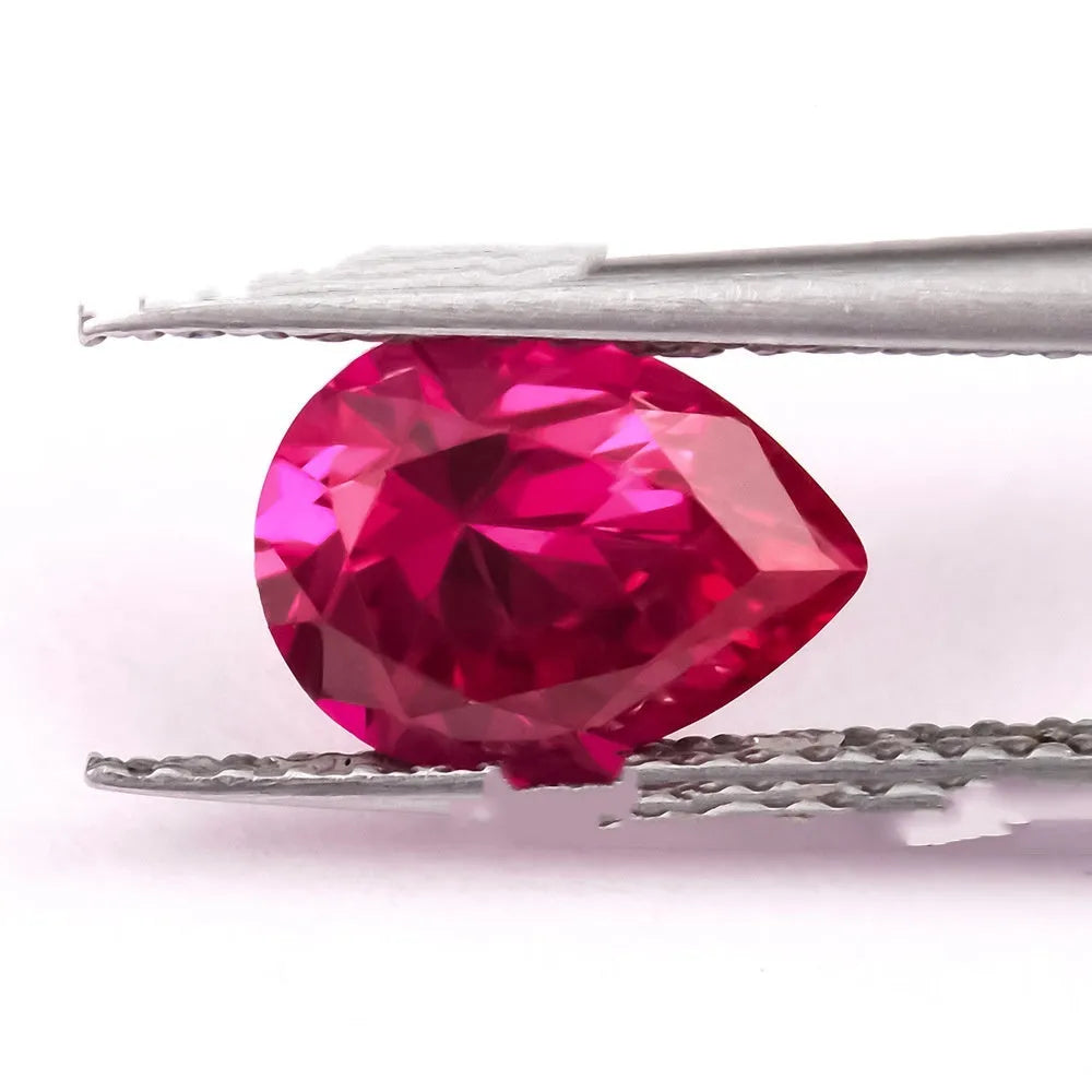 Cultivated pigeon blood red ruby gemstone in round cut on a white background.