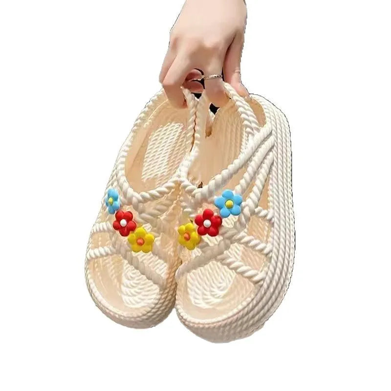 Women's beige PVC sandals with sunflower design, round toe and non-slip sole.