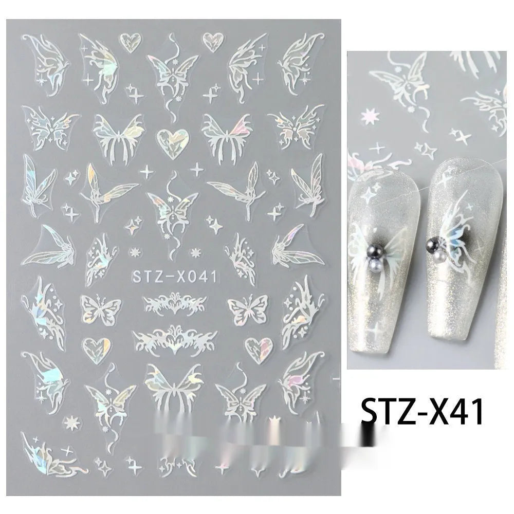 Sheet of black and silver love heart pattern nail art stickers with a plastic nail patch.