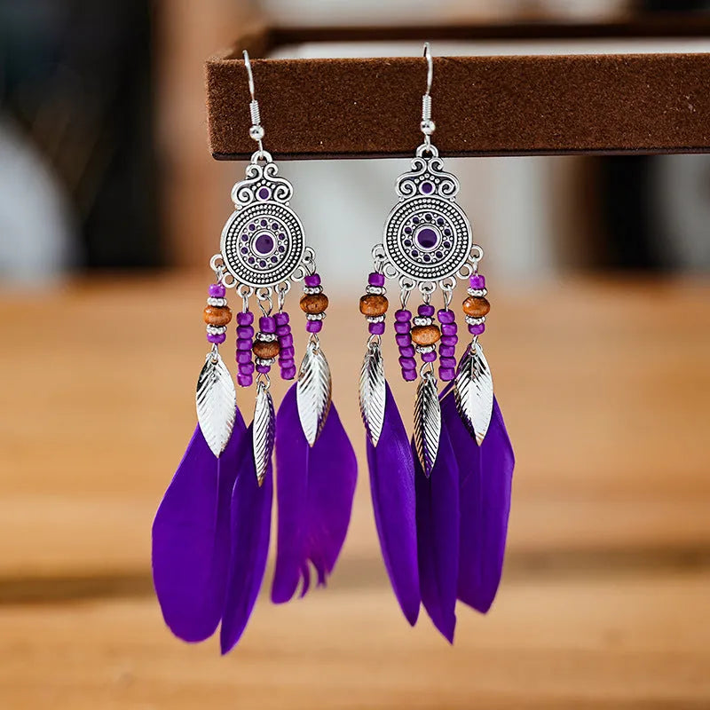 Round drop feather earrings with leaf detailing in various bohemian colours
