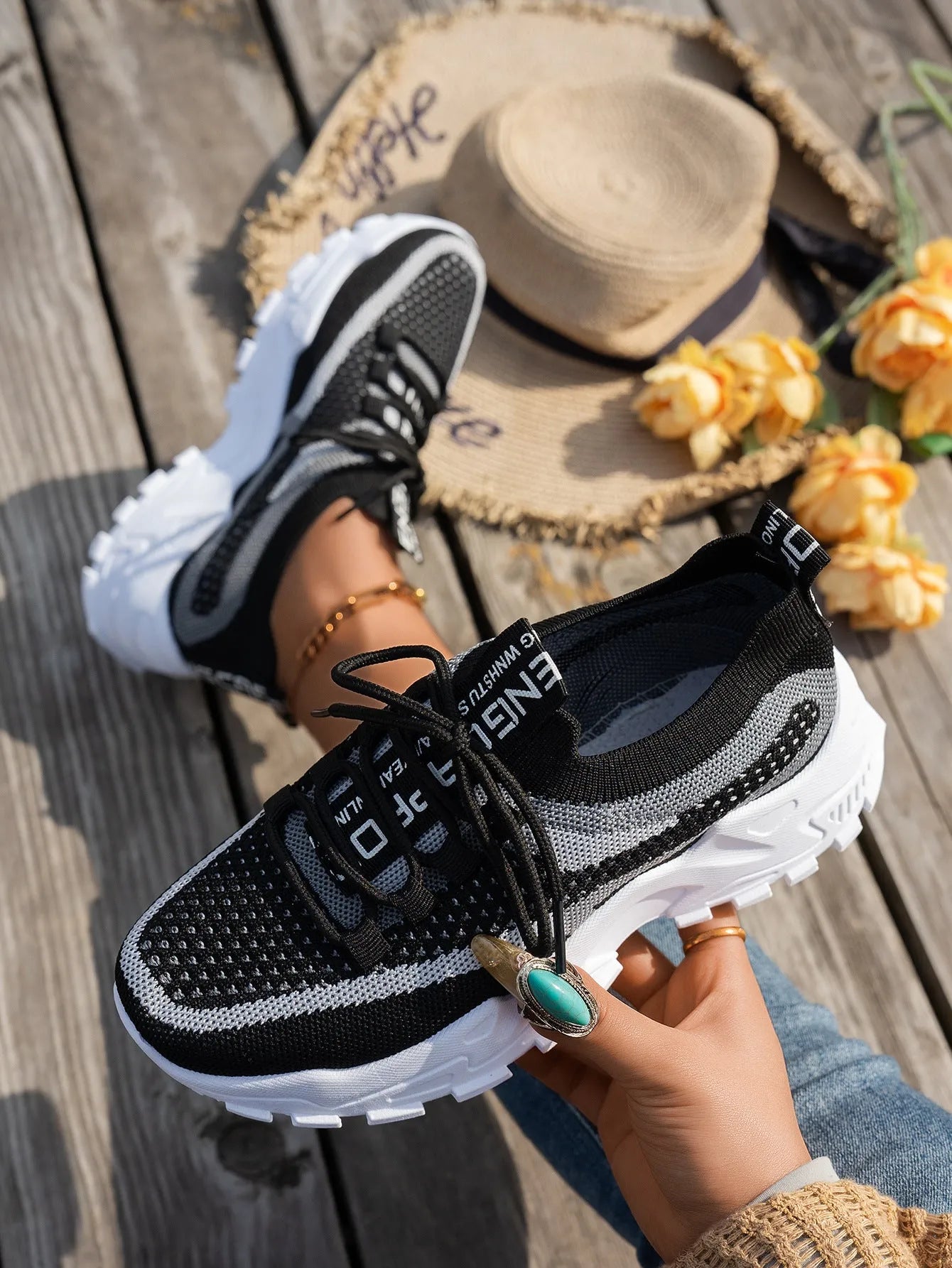 Women's Flyknit mesh lace-up sneakers in grey and white colourway
