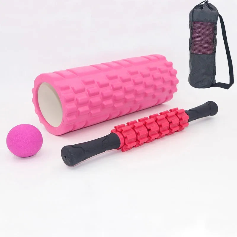 33cm long black foam roller massage stick with six raised gear pieces along its shaft.