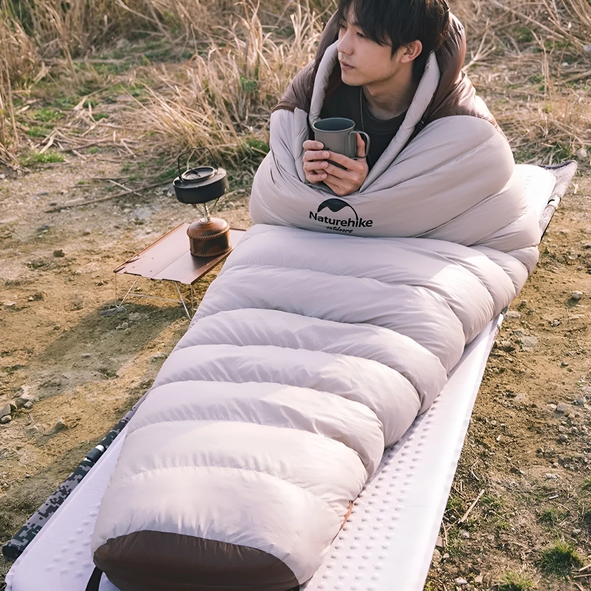 Goose down mummy sleeping bag for adult camping in a stuff sack