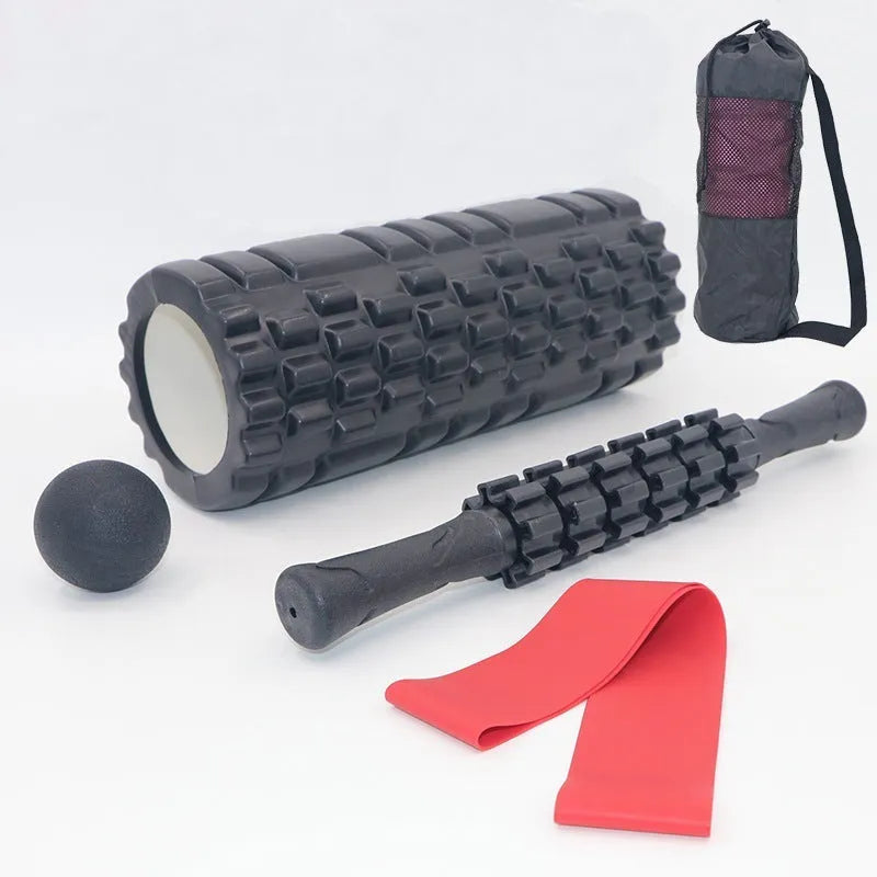 33cm long black foam roller massage stick with six raised gear pieces along its shaft.