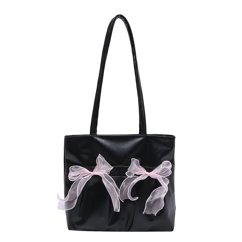 Black and pink college style bow tote bag with double straps and a front view.