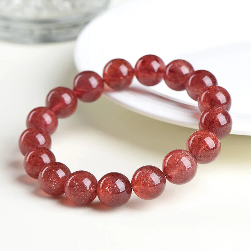 Natural strawberry quartz bracelet with geometric red crystal beads in three size options from 7mm to 10.8mm diameter