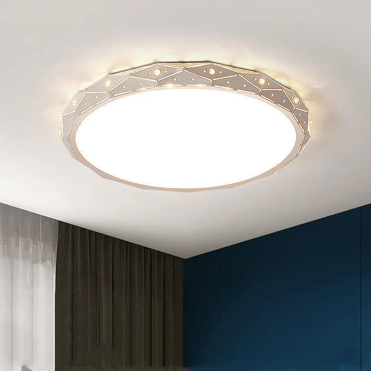 Round black and white framed LED ceiling light fixture for room installation.