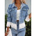 Blue women's denim jacket with lace stitching detail on the sleeves and front, featuring long sleeves.