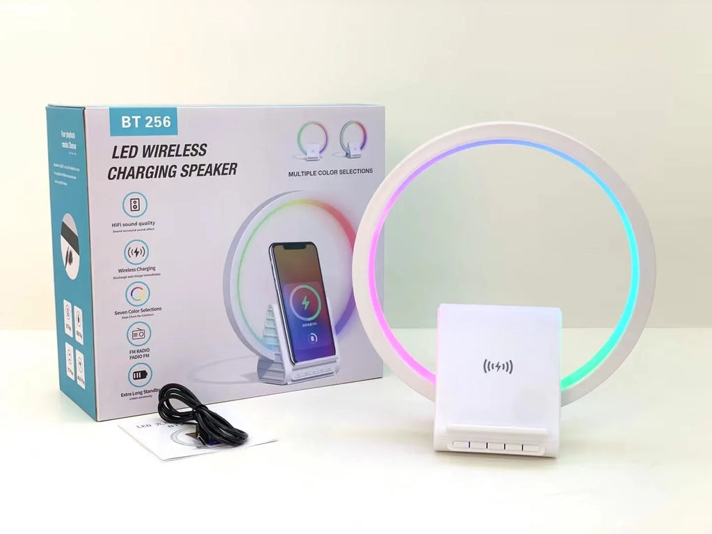 White smart Bluetooth speaker with ambient light ring and wireless charging surface