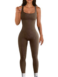Women's beige spandex suspender tank top tights with button detail, shown at full length.
