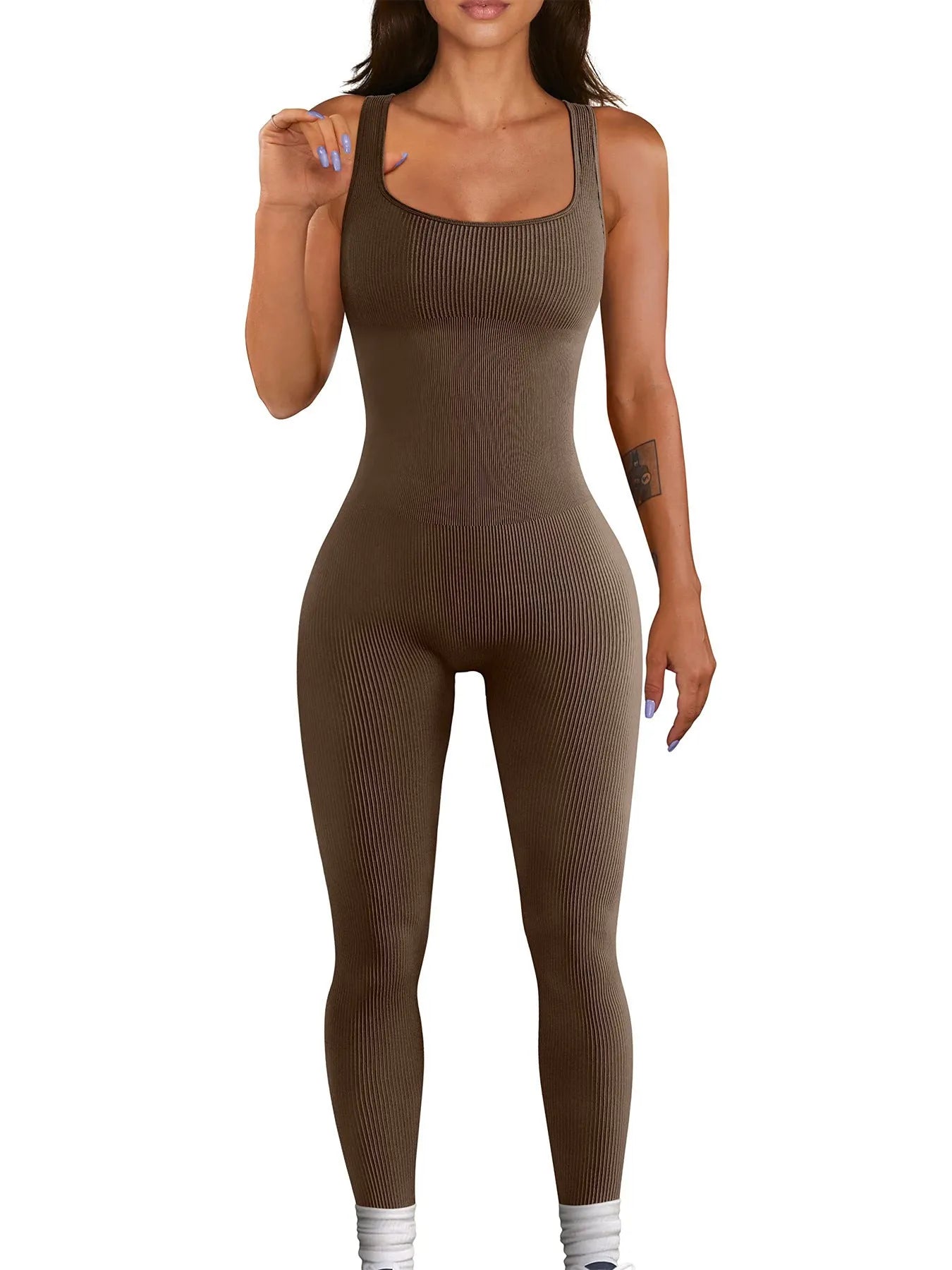 Women's beige spandex suspender tank top tights with button detail, shown at full length.