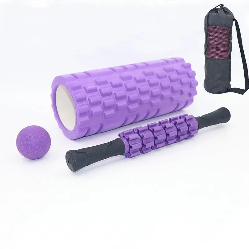 33cm long black foam roller massage stick with six raised gear pieces along its shaft.