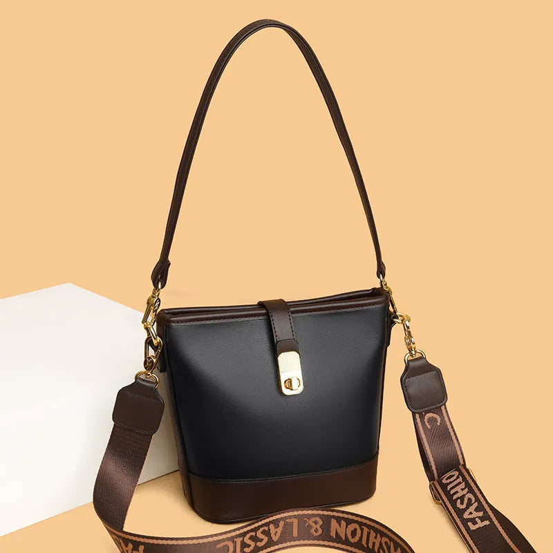 Korean style soft PU bucket messenger bag with adjustable straps in black showing internal zipper compartments