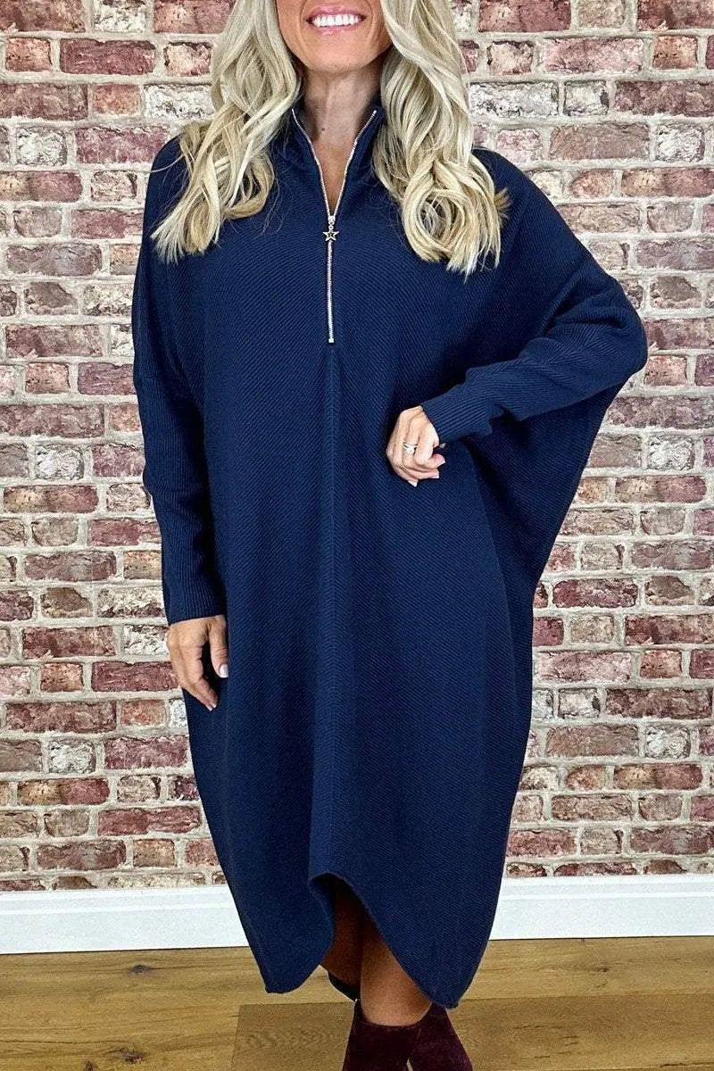Women's solid colour loose knitted dress with raglan sleeves, shown in dark green.