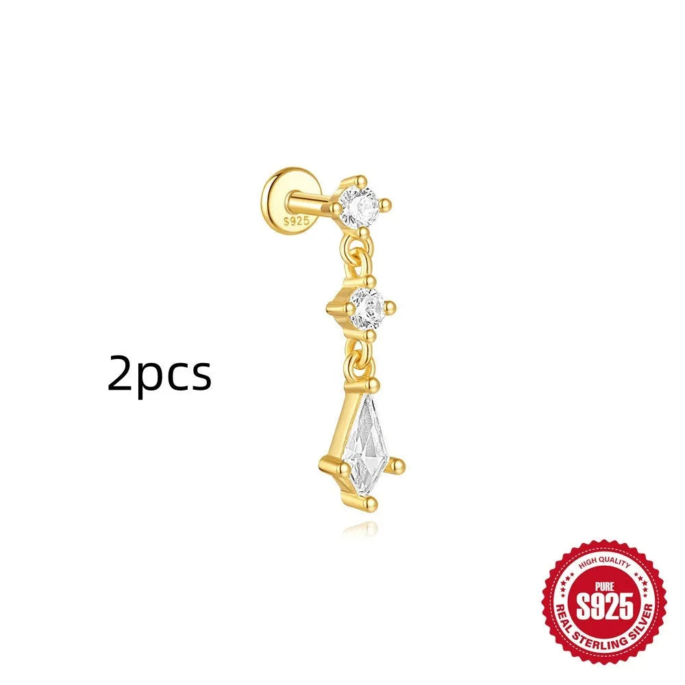 Geometric kite-shaped sterling silver earrings with a gold electroplated chain tassel featuring rhinestones.
