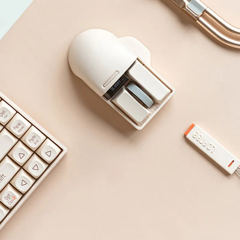 Xiaoqiao Tofu Colour wireless computer mouse with USB receiver on a desk.