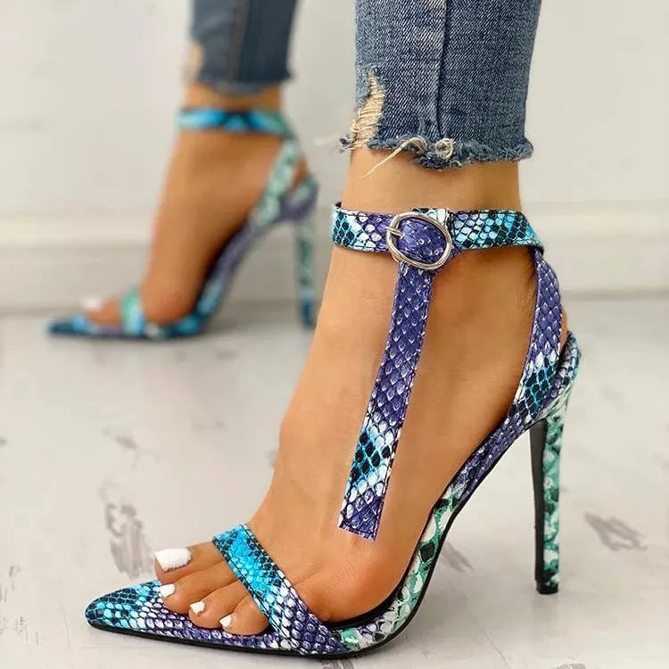 Blue women's high heel shoes with a buckle fastening and glossy patent leather finish.