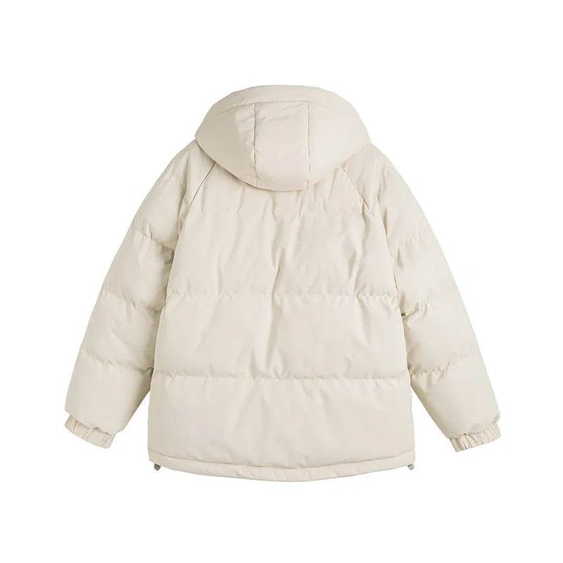 Loose beige cotton-padded jacket with side seam pockets on a hanger