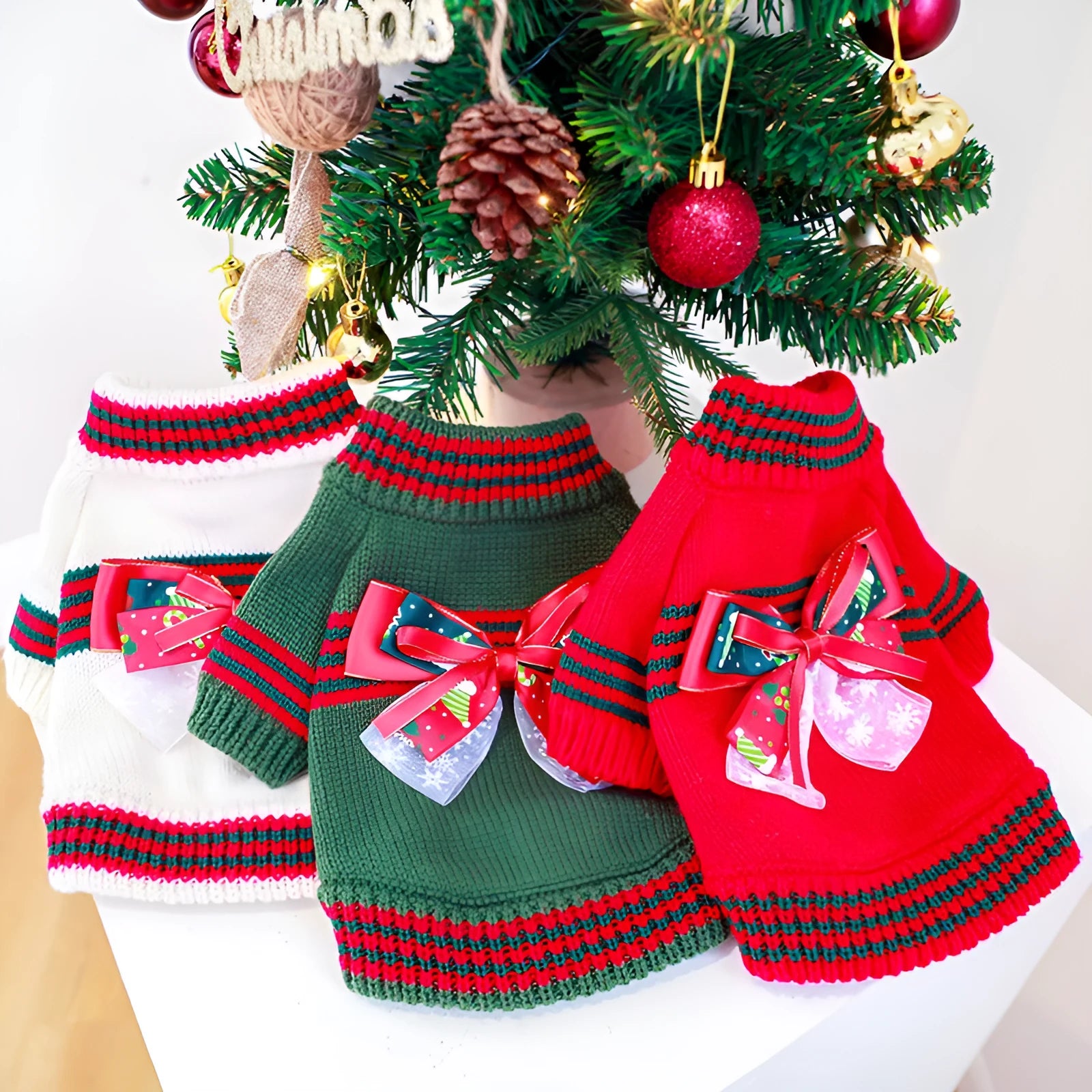A red polyester Christmas jumper for a dog, shown on a mannequin, with sizes ranging from XS to XL.