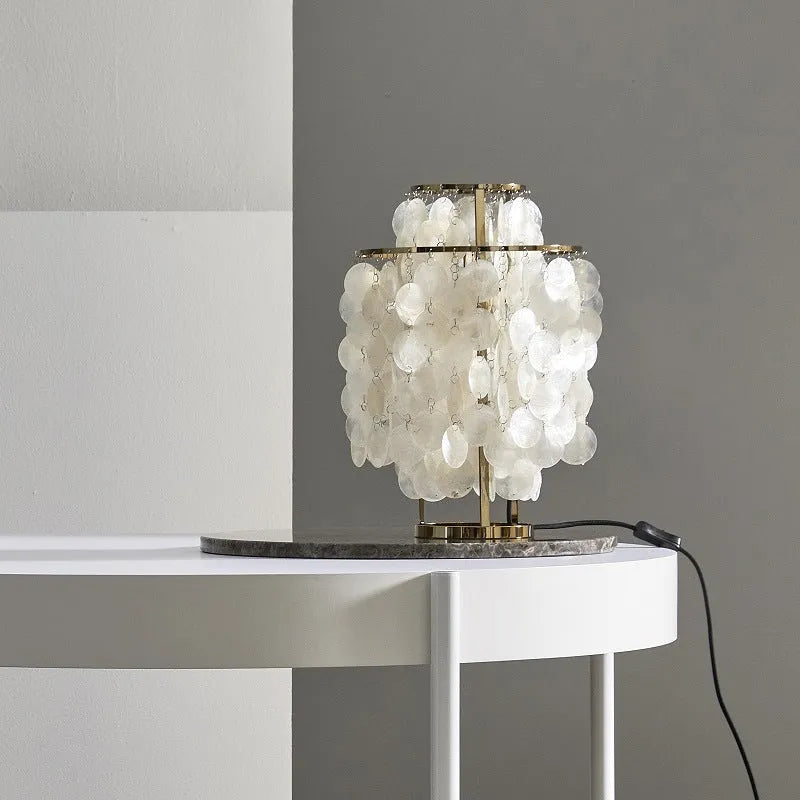 Modern shell design bedside table lamp in chrome or gold finish with slim profile