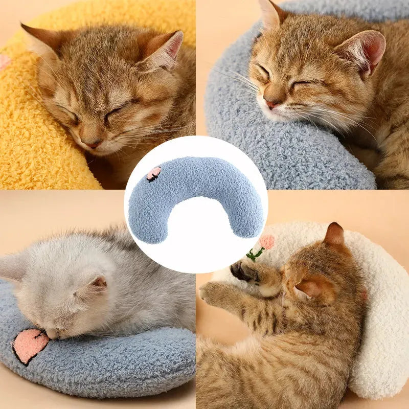 Small white half-donut shaped pet pillow with quilted faux fur for a cat or small dog.