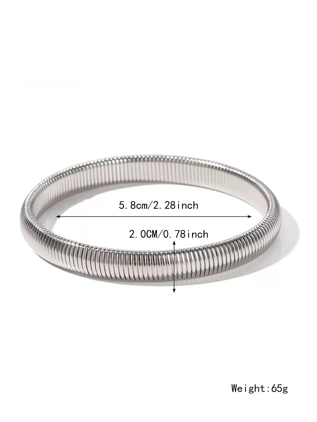 Close-up of a women's elastic titanium steel bracelet featuring a bold vertical stripe ring pattern in a gold tone finish.